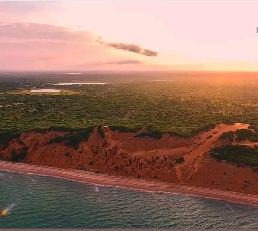 Red Dunes of Vilanculo — An aerial view of the coast at sunset